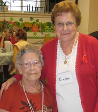 Two women wearing red